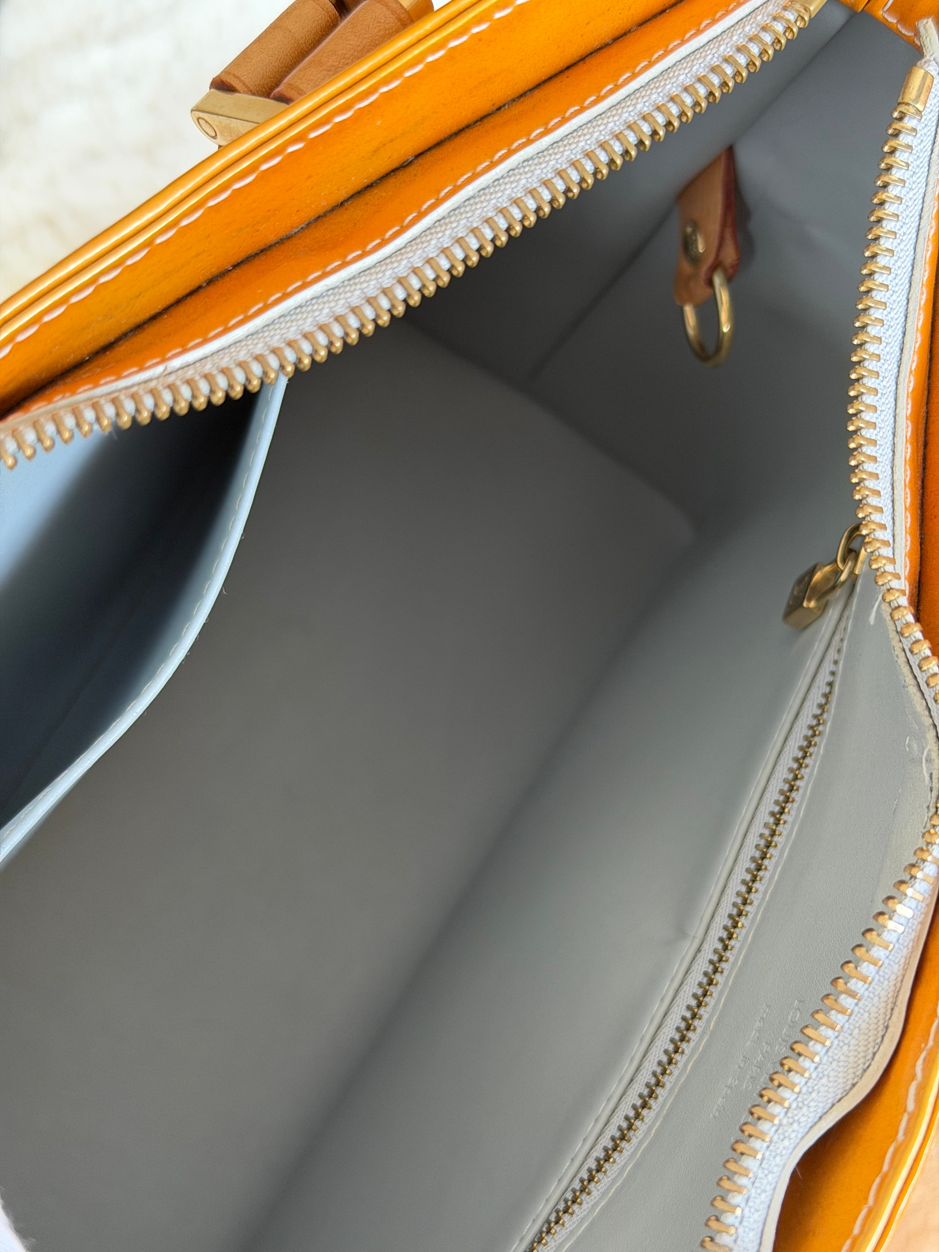 Louis Vuitton Houston in Yellow Vernis Leather